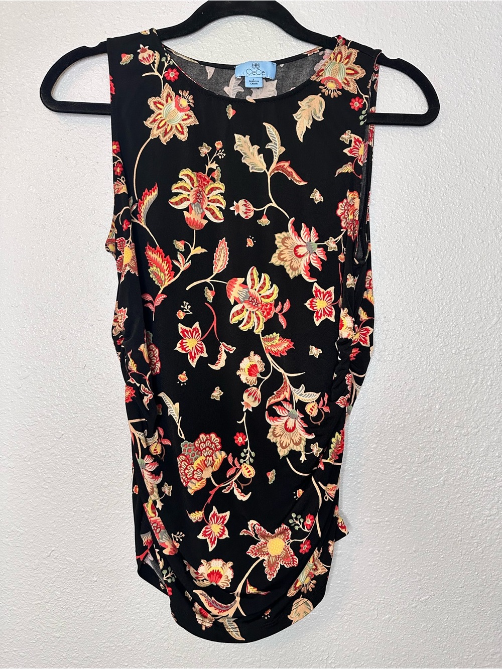 CeCe Black Sleeveless Floral Blouse with Red & Cream Accents